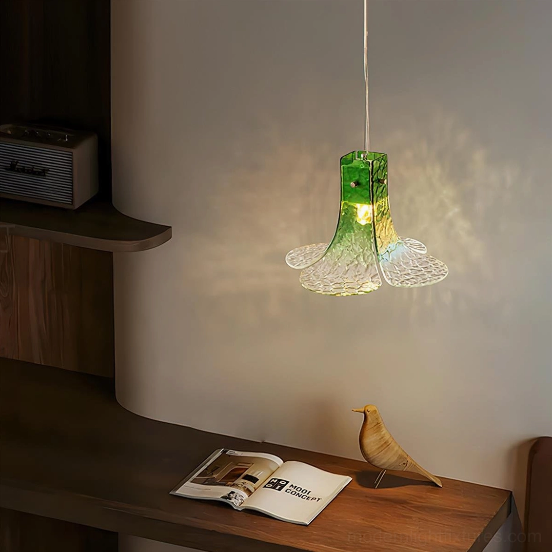 Hand-blown botanical glass pendant lamp in home office workspace with warm diffused illumination