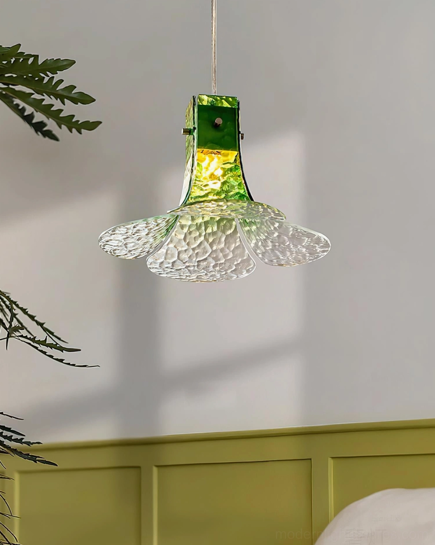 Artisanal botanical glass pendant lamp in modern minimalist interior design setting with natural light