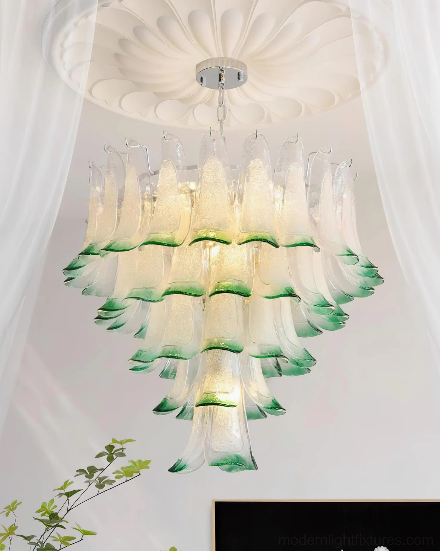Tiered glass petal chandelier creating botanical-inspired ambiance in contemporary interior design