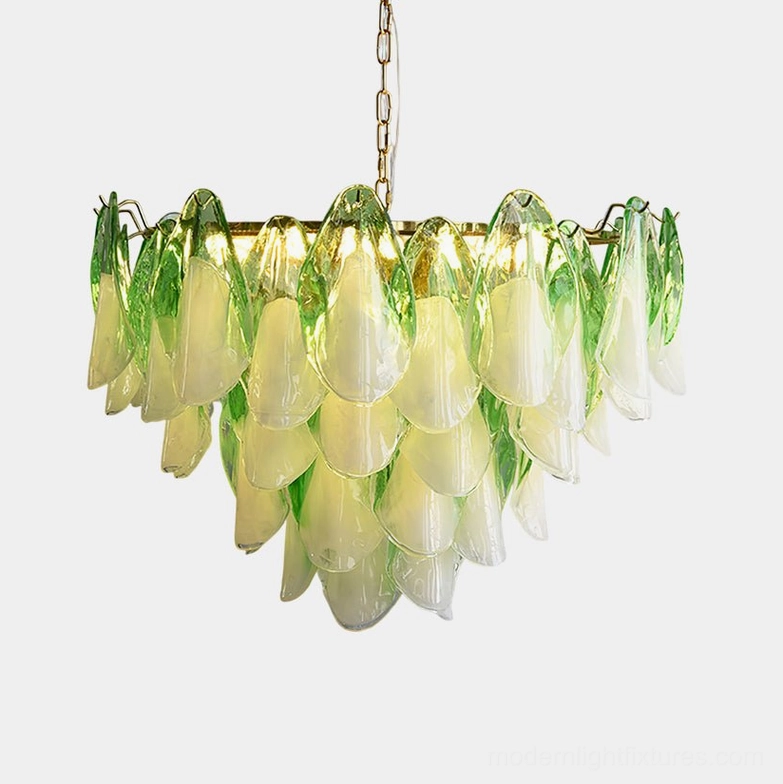 Botanical glass petal chandelier with ombre effect, gold metal frame, and hanging chain on white background