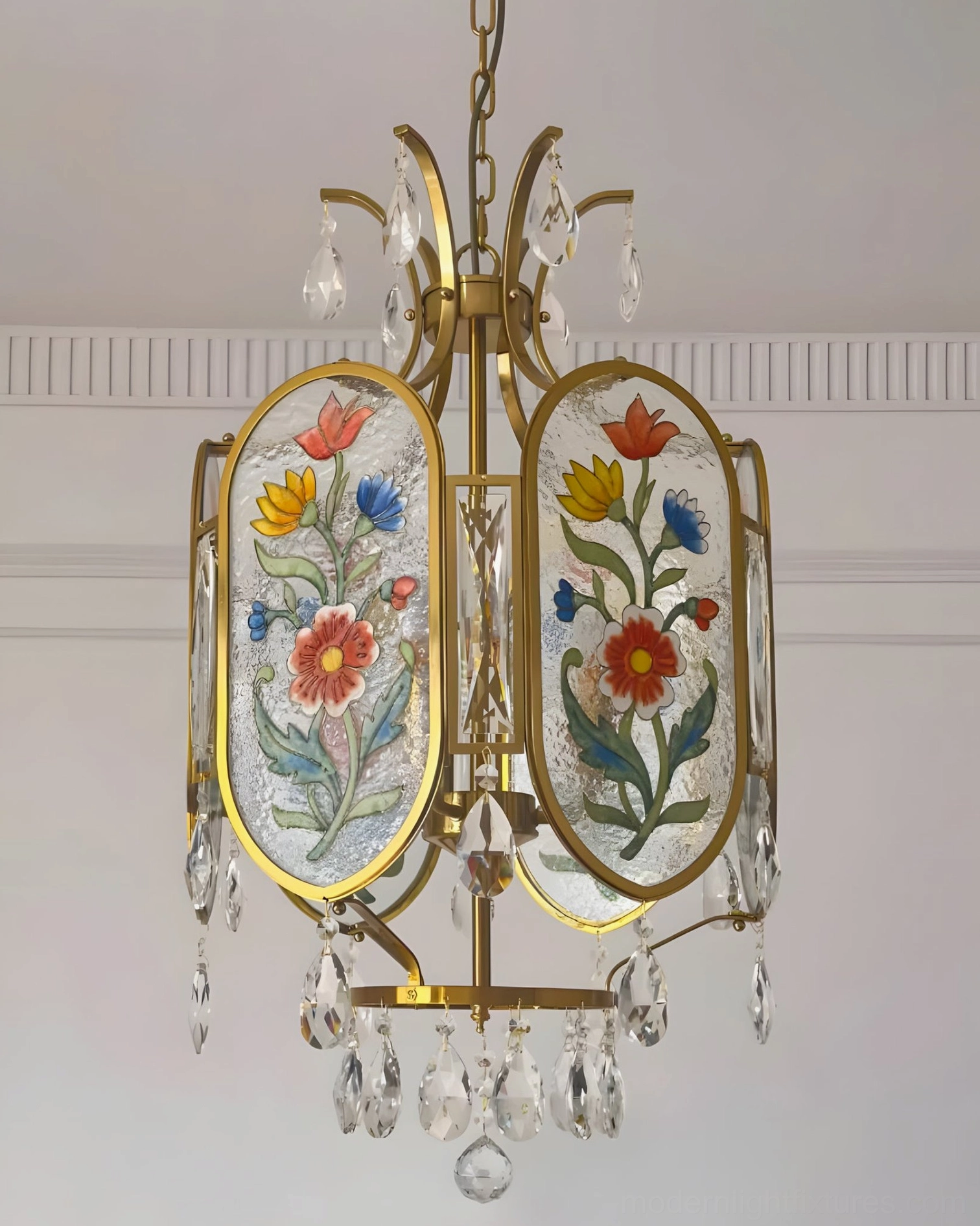 Hand-painted botanical pendant light with brass frame showing detailed floral artwork on individual glass panels
