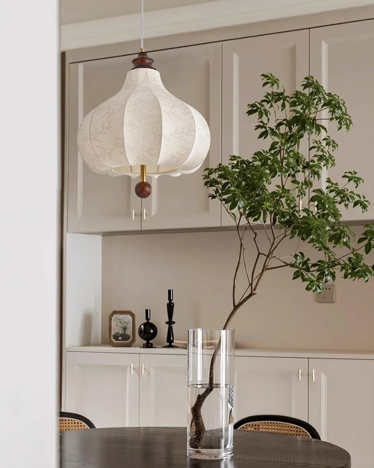Vintage botanical pendant lamp creating ambient lighting in eclectic interior with mixed furniture styles