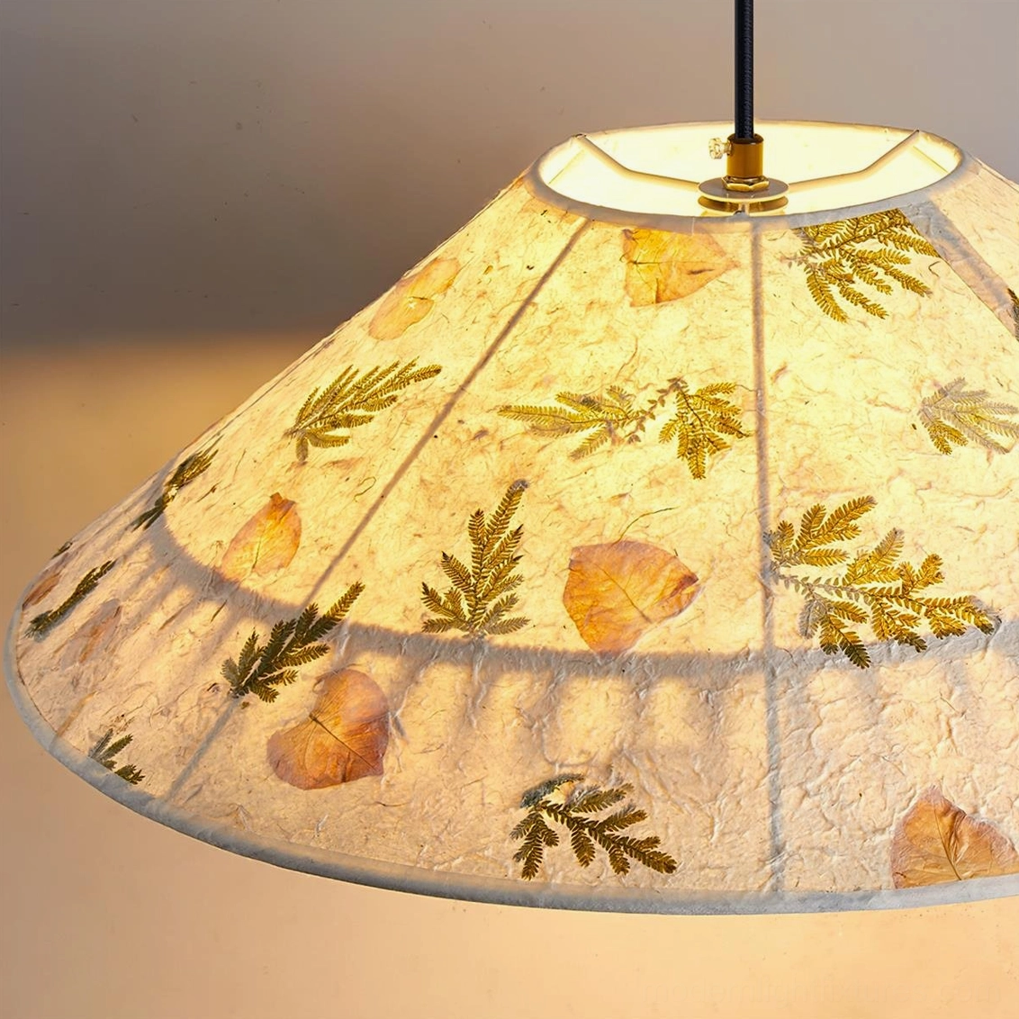 Botanical hemp rope and rattan frame construction detail of pressed rice paper pendant lamp