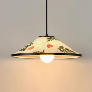 Botanical pendant light with exposed bulb glowing warm inside beige rice paper shade with embedded dried leaves