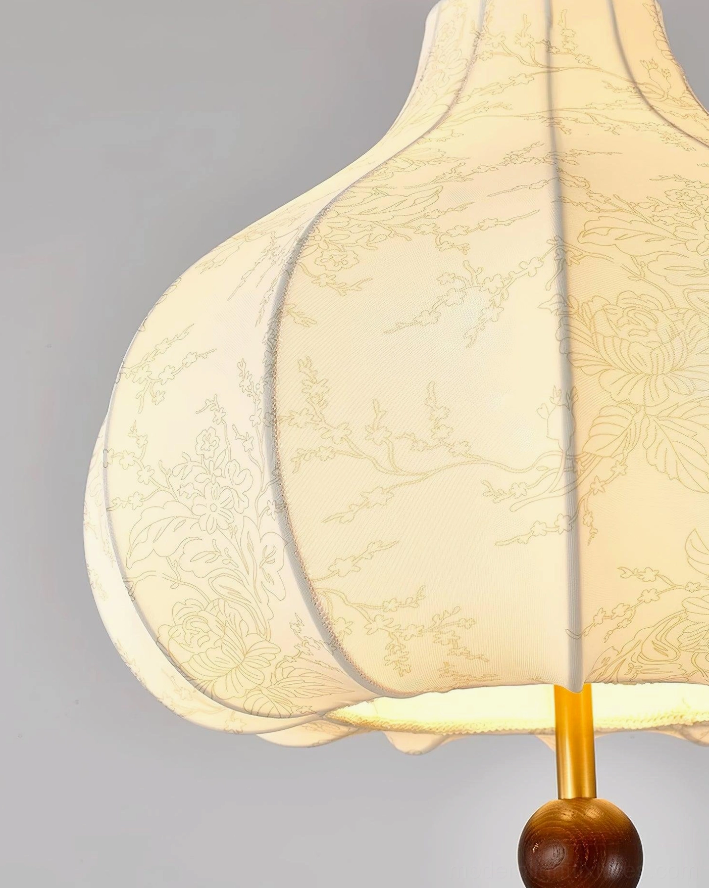 Botanical fabric pendant lamp overhead view showing circular shade shape and central bulb configuration