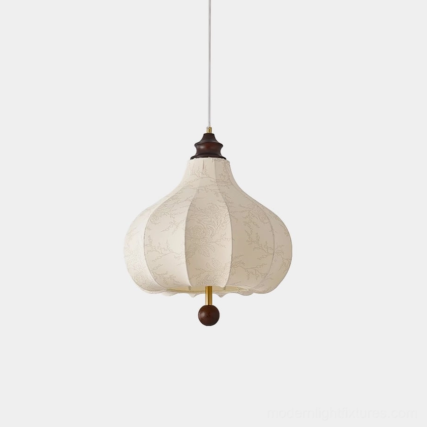 Botanical pendant lamp with white fabric shade featuring intricate floral print design, dark wood and brass hardware, front view against neutral background