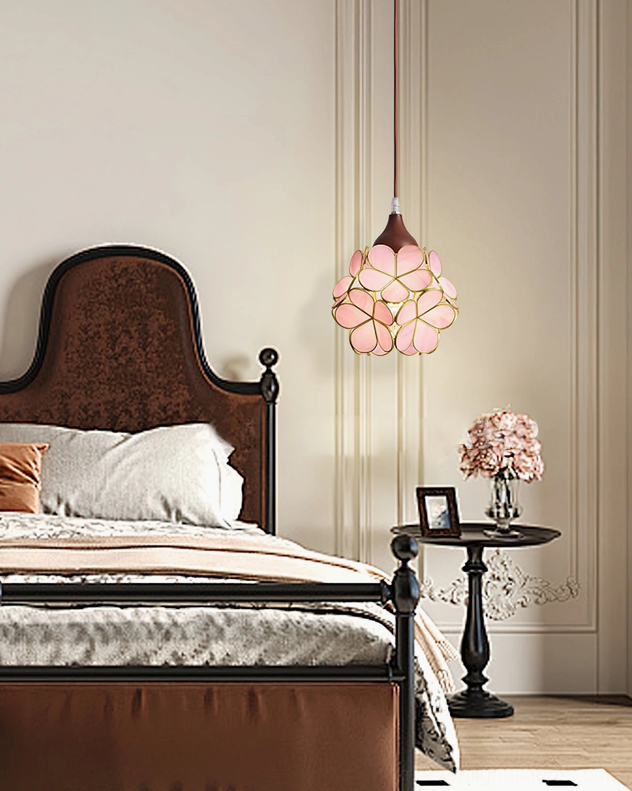 Modern flower pendant light hanging beside bed in dark wood bedroom, creating warm intimate ambient lighting