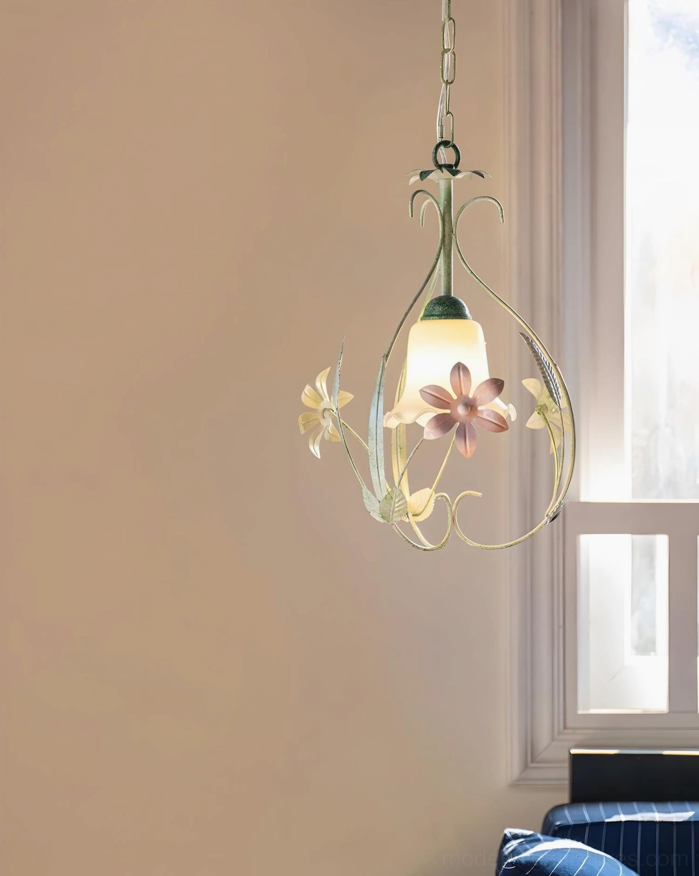 Botanical pendant light in combined living-dining space with warm country cottage design and natural window lighting ambiance