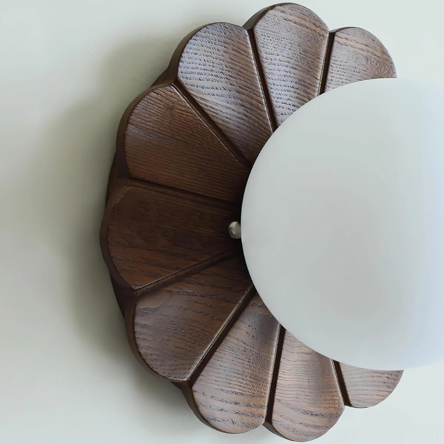 Modern wood and glass petal wall sconce showing complete design from multiple angles in styled setting