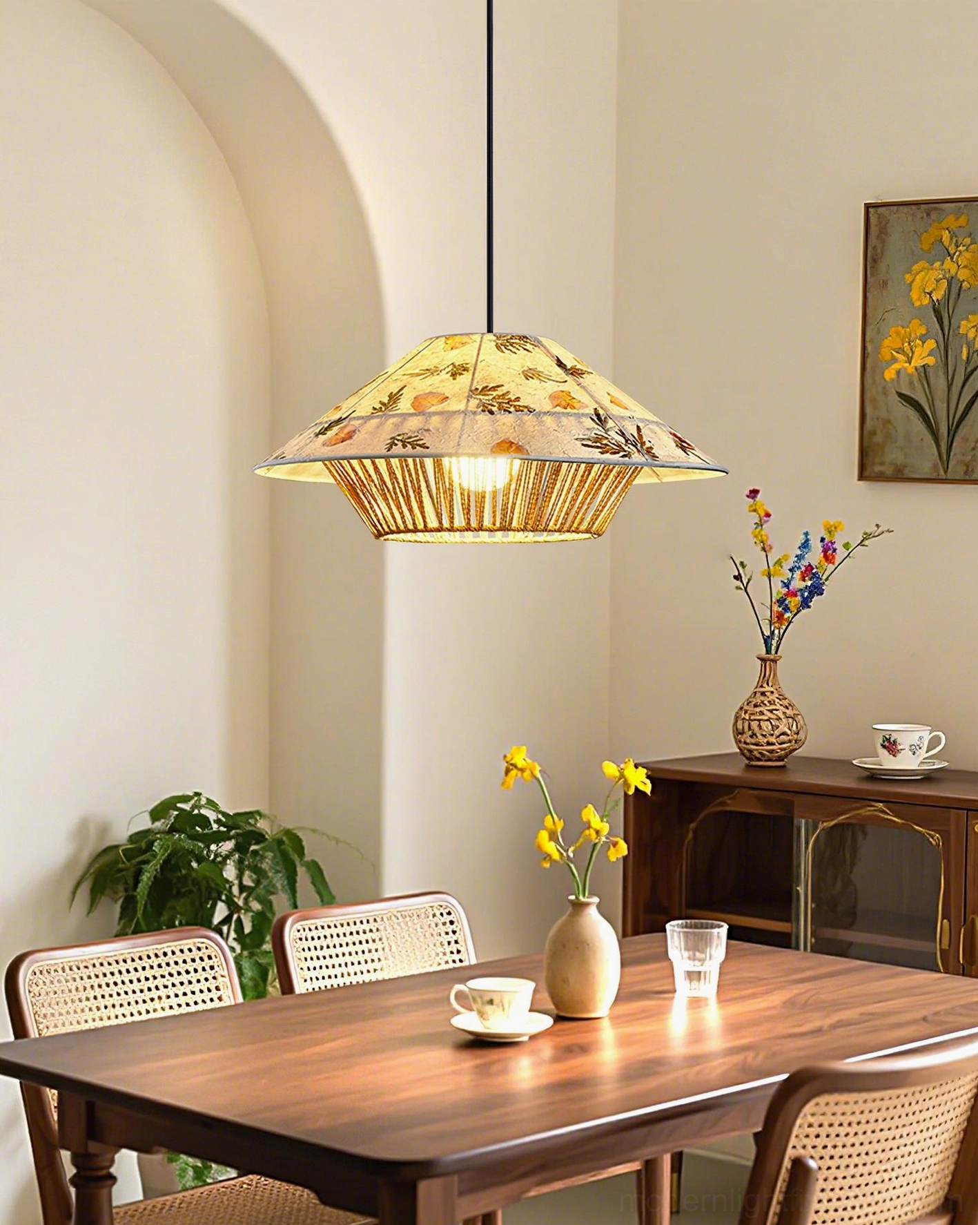 Botanical pressed rattan pendant lamp suspended in modern warm dining room bohemian lighting decor