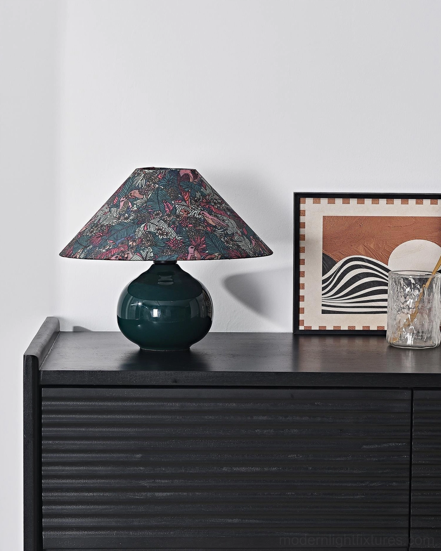 Forest green botanical ceramic table lamp demonstrating mid-century modern aesthetic with botanical pattern shade for eclectic décor