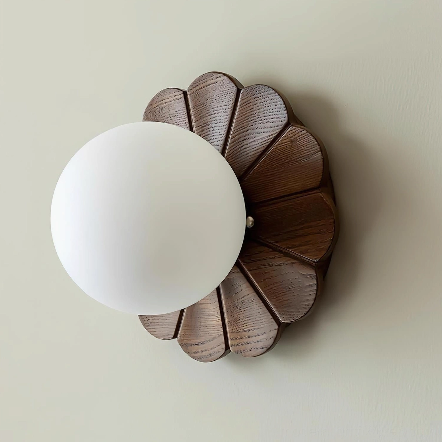Side profile of modern wood petal wall light showing large frosted glass shade and wood grain texture