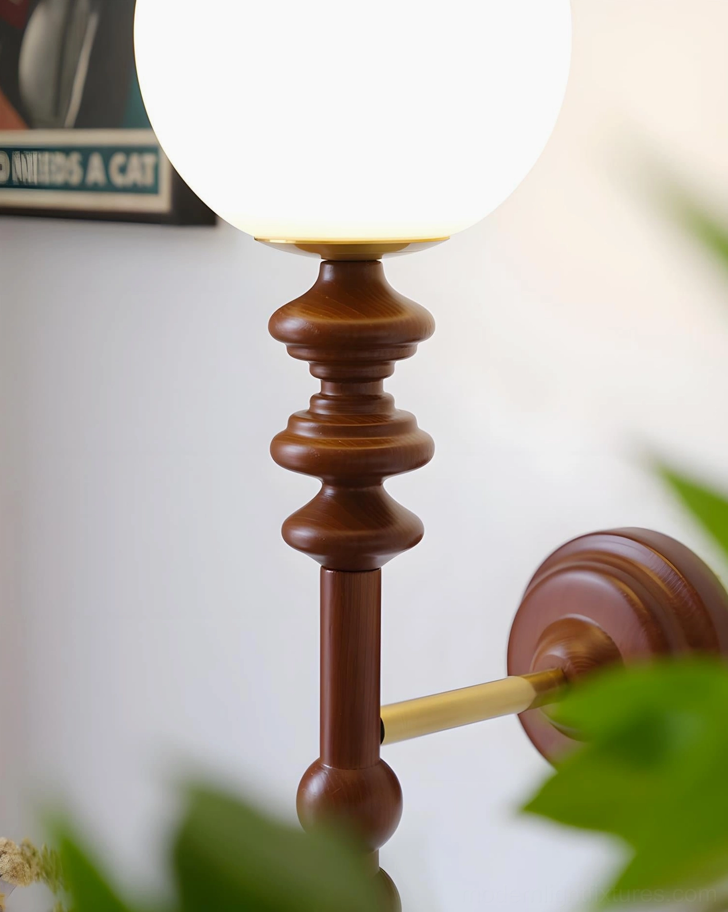 Bouton contemporary wall sconce with geometric spherical glass shade and minimalist metal arm