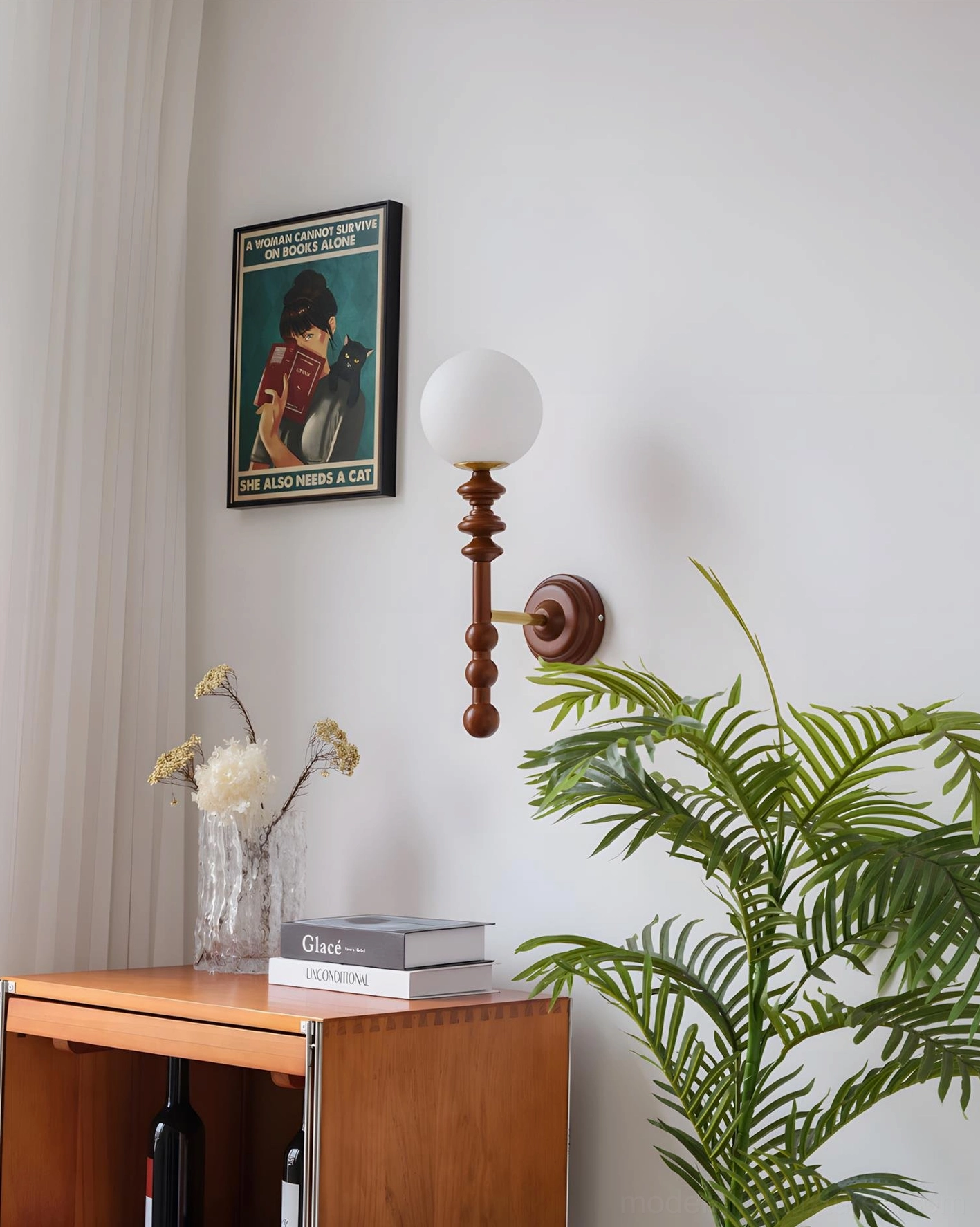 Bouton minimalist wall sconce in home corner setting paired with indoor greenery and vintage décor