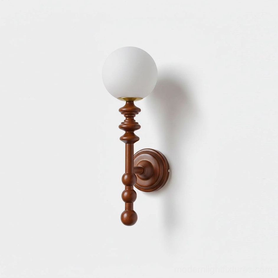 Bouton minimalist wall sconce with spherical frosted glass diffuser and sculpted wooden arm on white wall