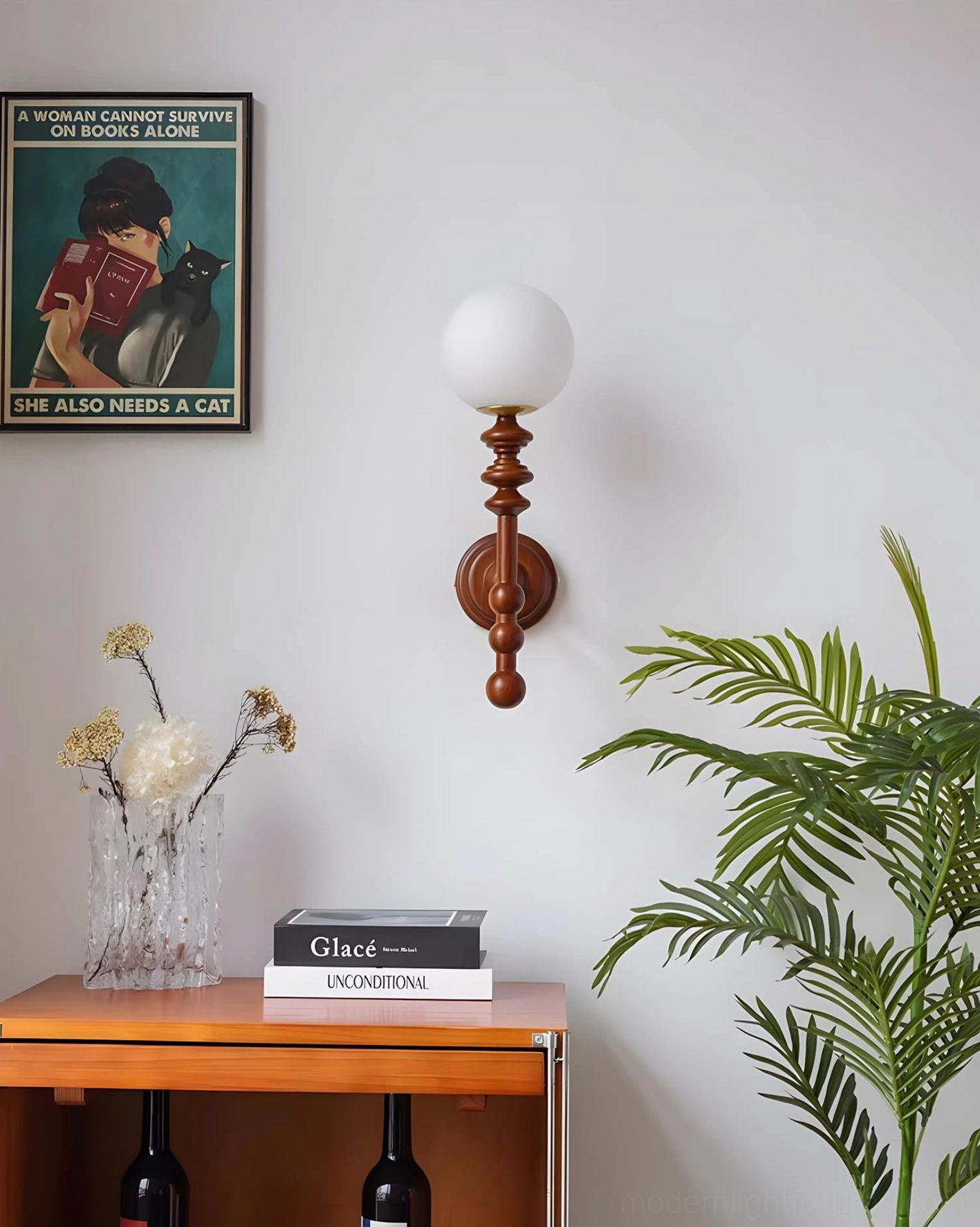 Bouton wall sconce side profile showing curved wooden arm and spherical glass diffuser