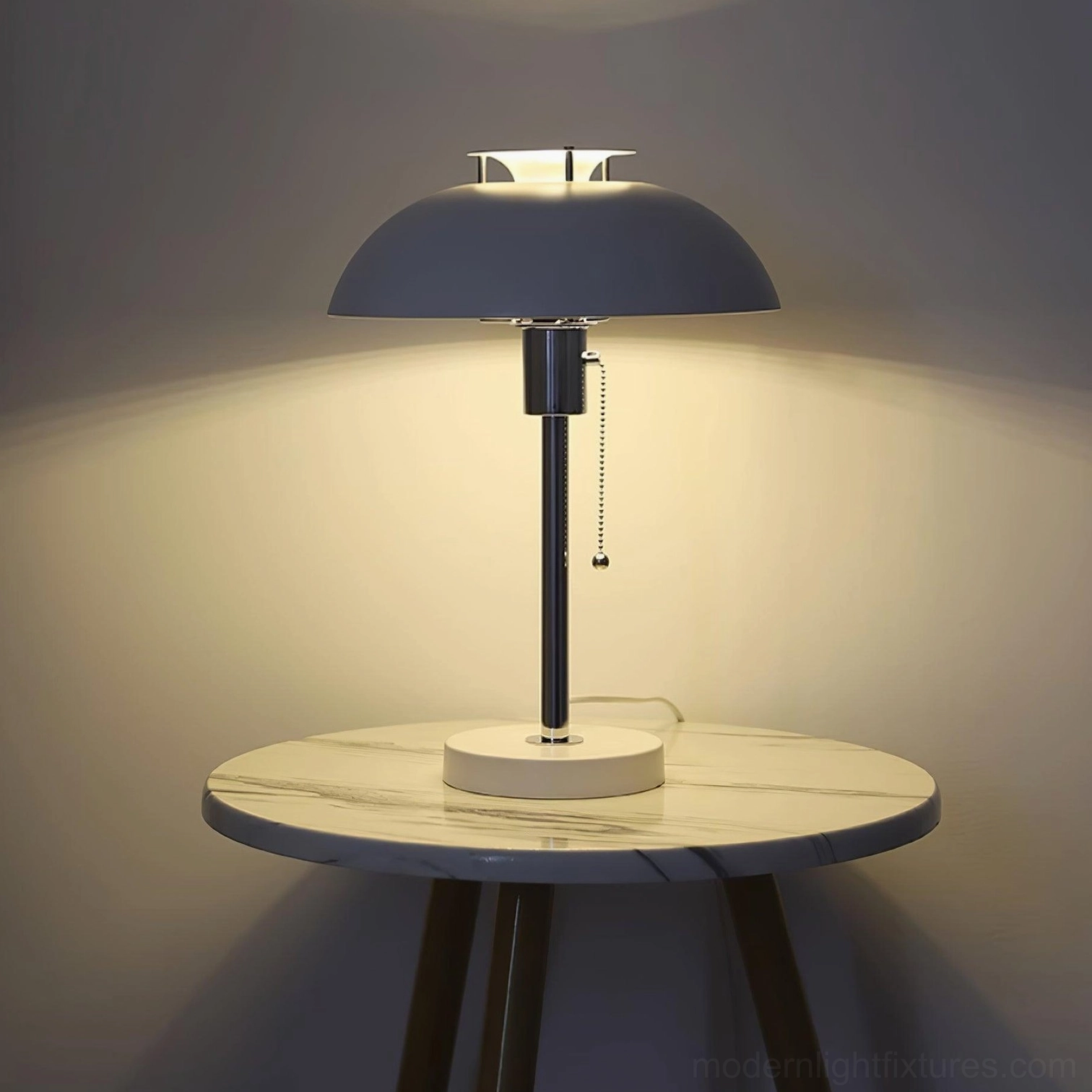 Bowie table lamp base detail showing push-button switch and metal construction quality