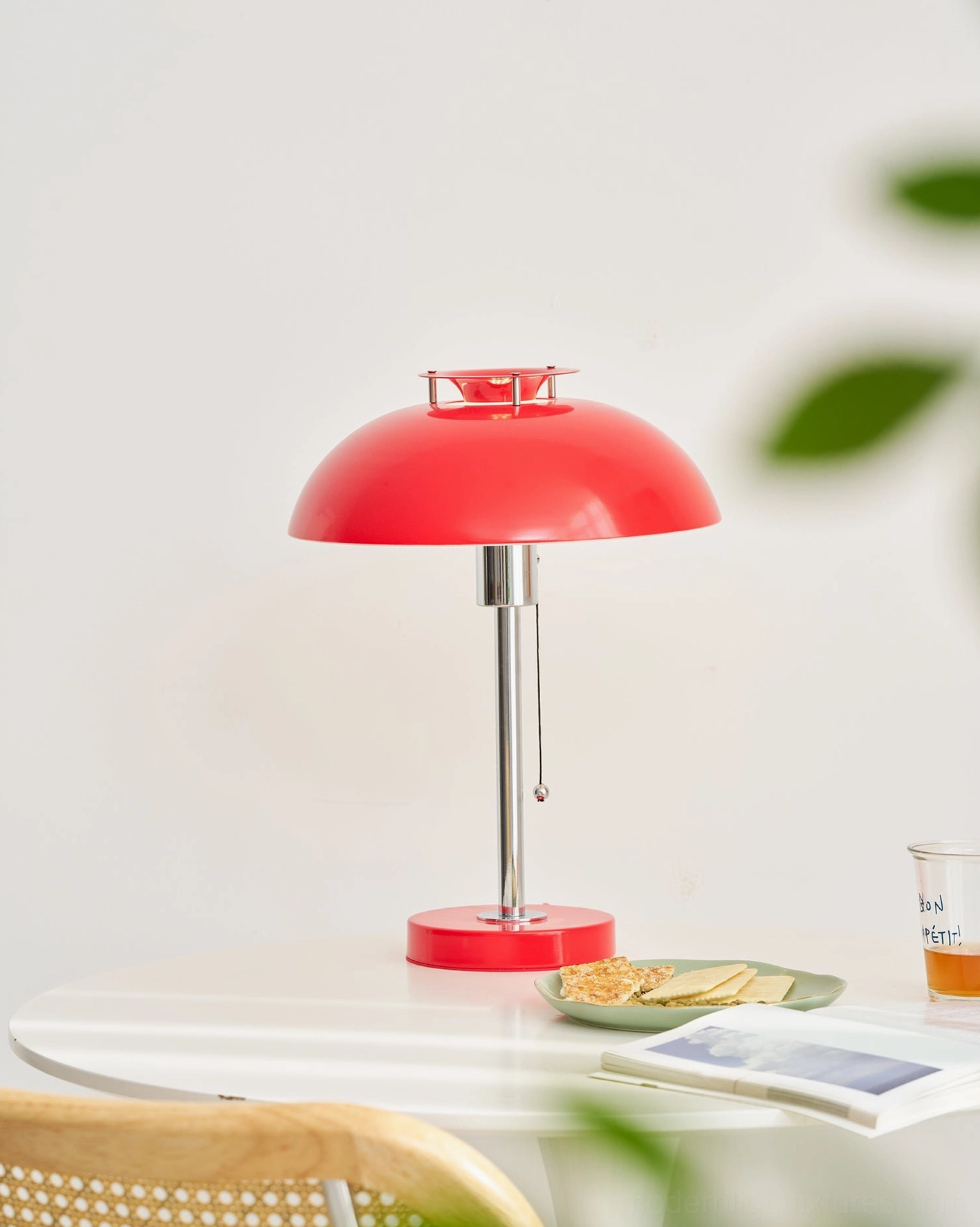 Bowie mid-century modern table lamp front three-quarter angle on casual dining table with chrome stem detail