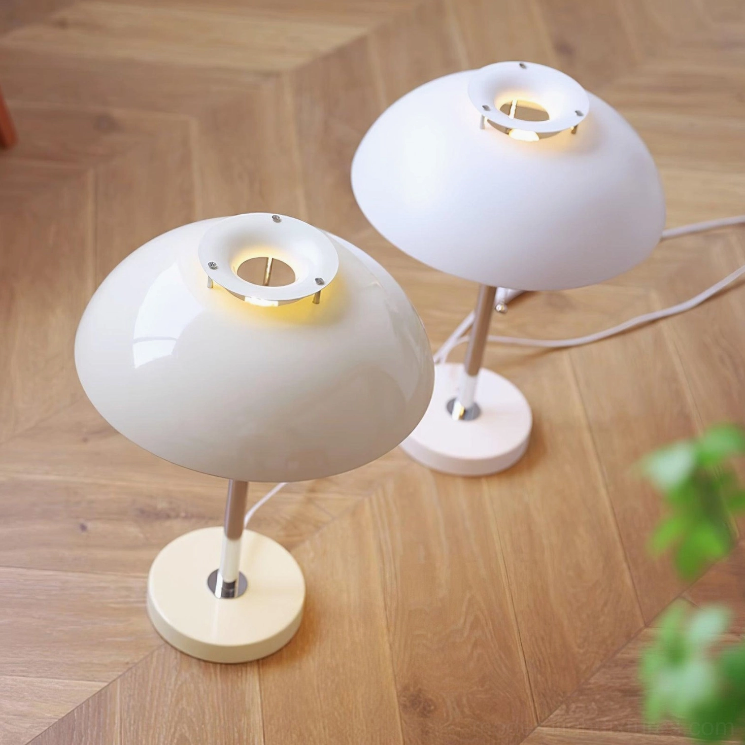 Bowie table lamp placed in minimalist room setting with neutral background emphasizing design