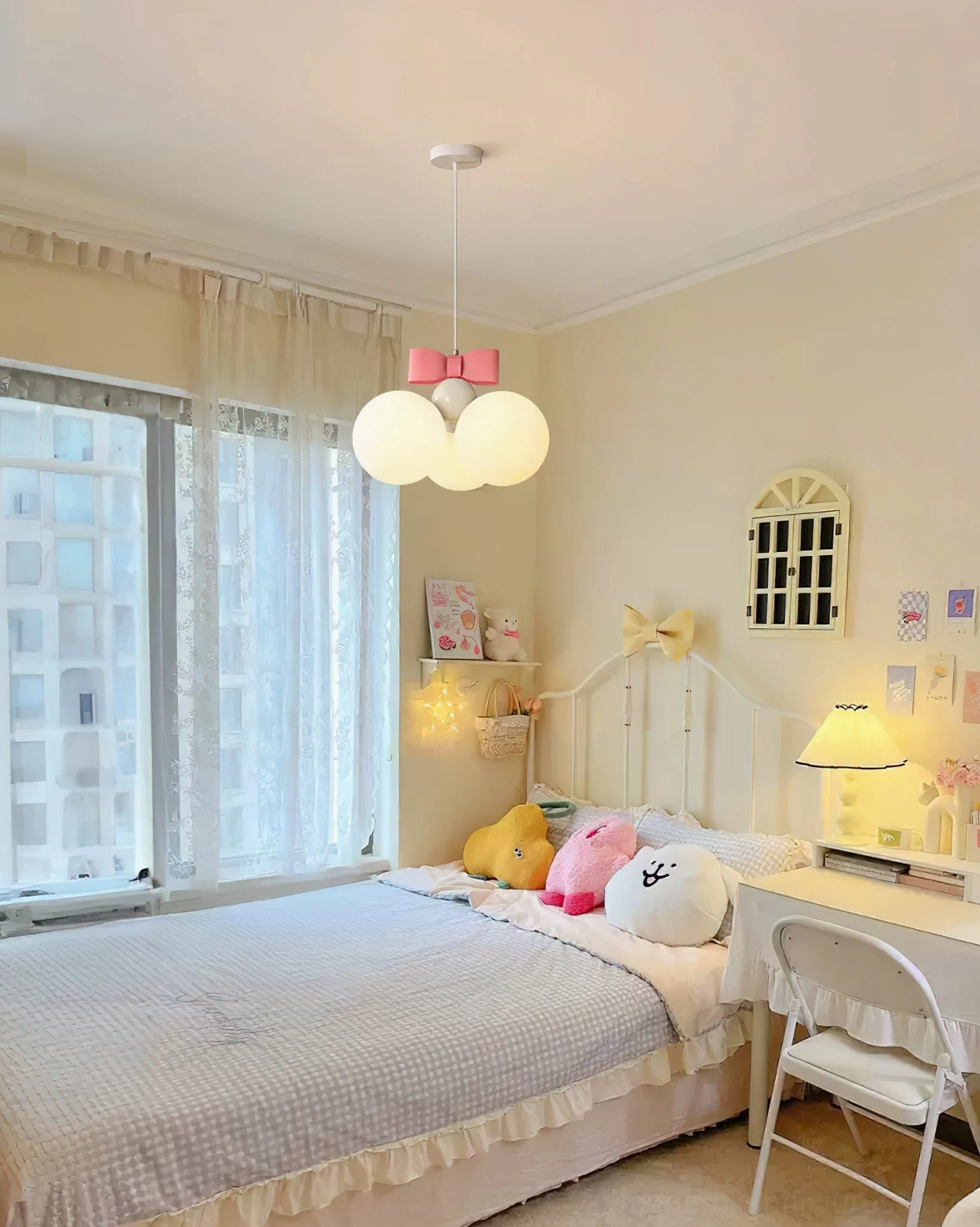 Bowknot pendant light installed in French cream bedroom creating warm ambient glow above bed