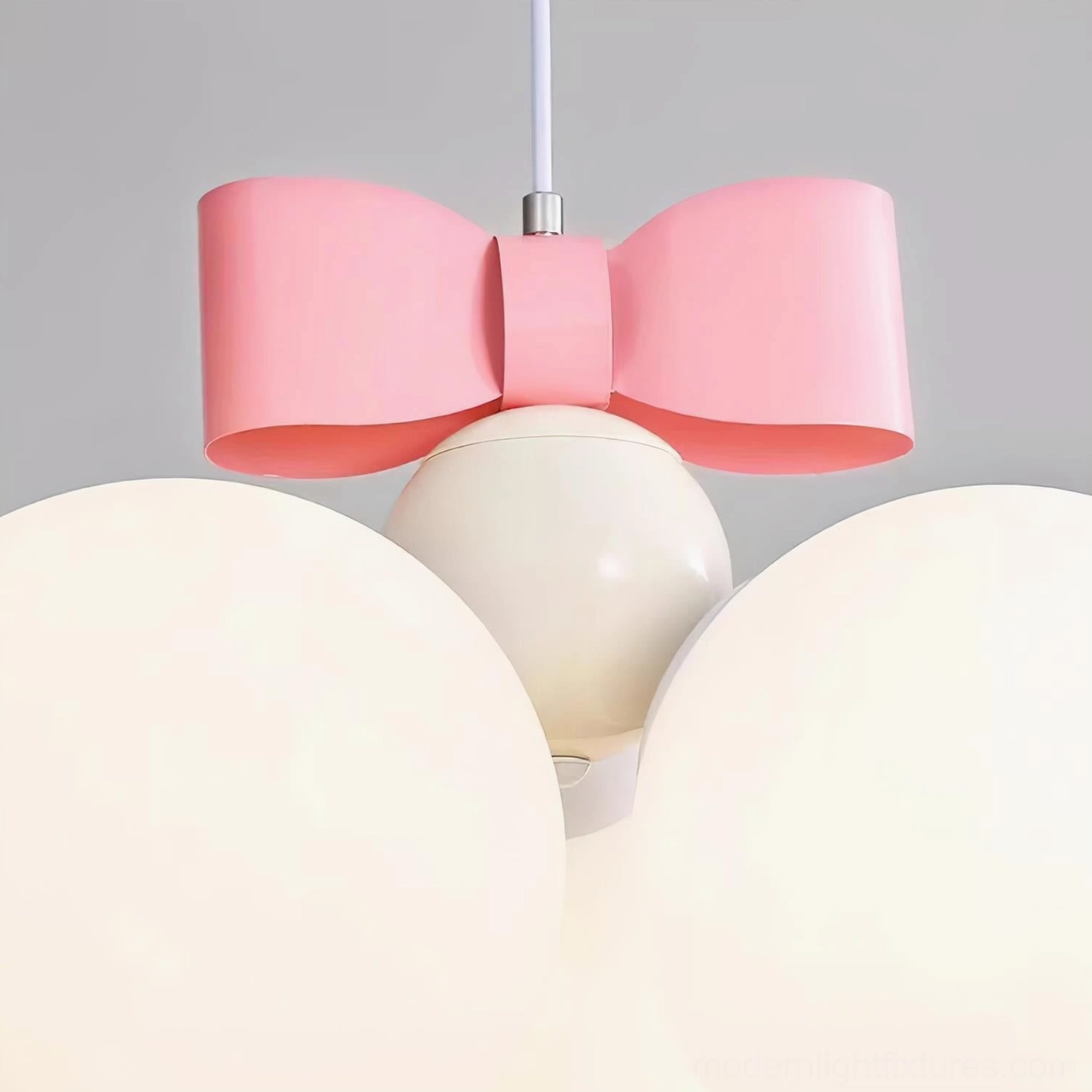 Bowknot pendant light in modern minimalist bedroom with clean aesthetic and neutral palette