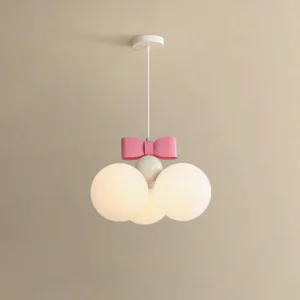 Bowknot pendant light displaying white frosted glass spheres with pink decorative bow at eye level