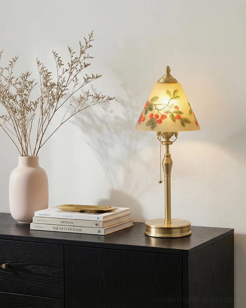 Bramelle vintage table lamp illuminated on minimalist living room console with dried flowers and stacked books, modern cottage style