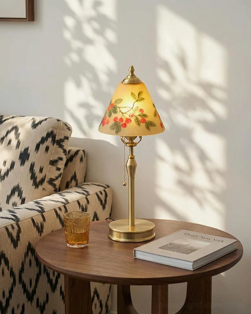 Bramelle hand-painted cherry glass shade close-up detail, showing botanical leaf and cherry motif with warm light diffusion