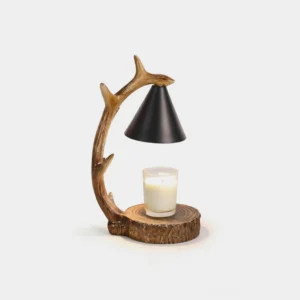 Forked branch candle warmer lamp with faux wood resin body and matte black metal shade, three-quarter front view on white studio background
