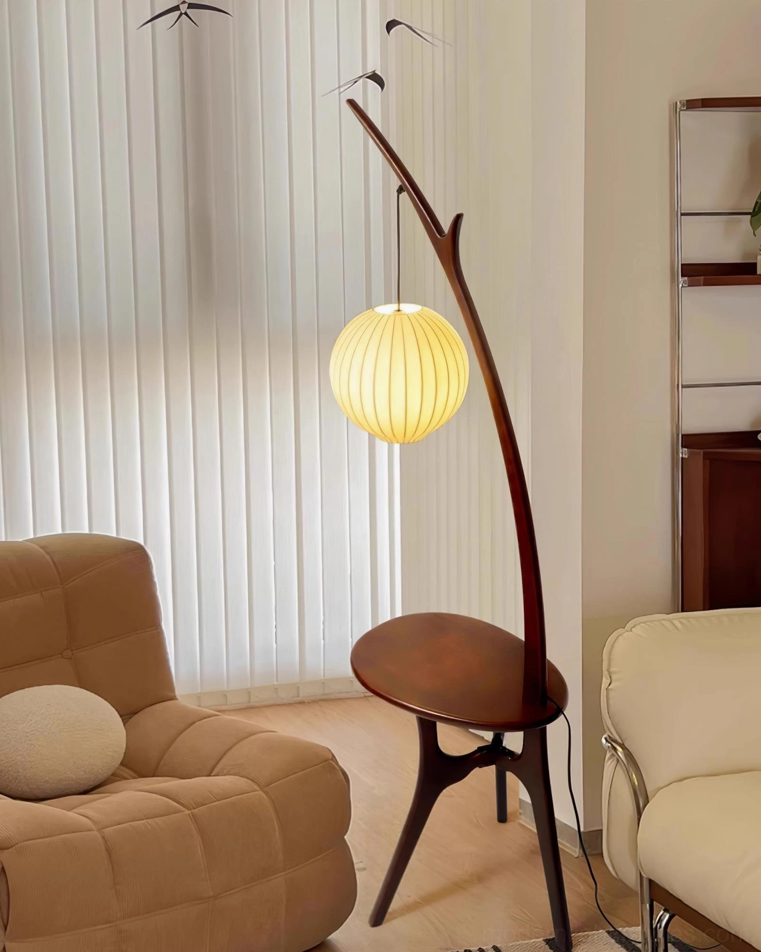 Branch-inspired floor lamp with integrated side table and warm fabric lampshade in cozy interior