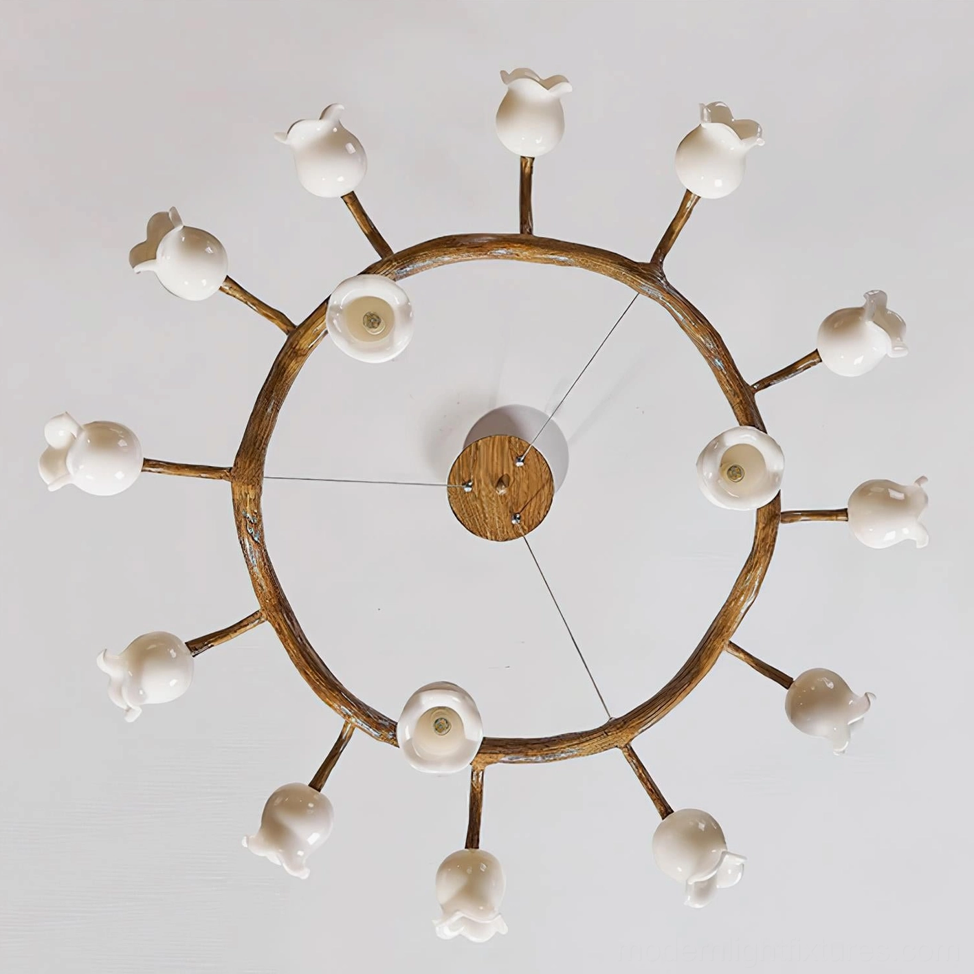 Branch lily of the valley chandelier close-up showing white shade craftsmanship and organic design