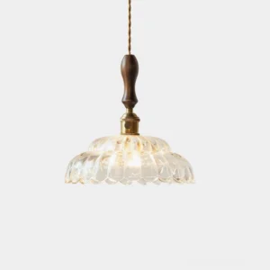 Brandon scalloped glass pendant light with walnut wood handle and brass accents, studio frontal view