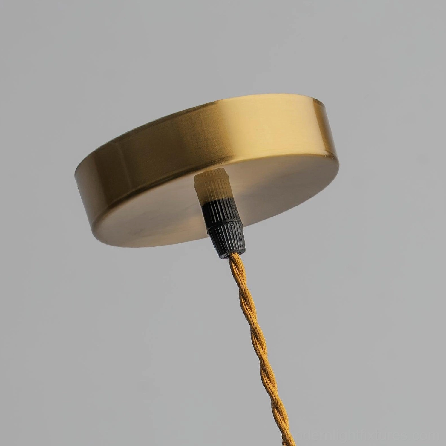 Pendant light shade closeup showing scalloped fluting pattern and clear glass refraction detail