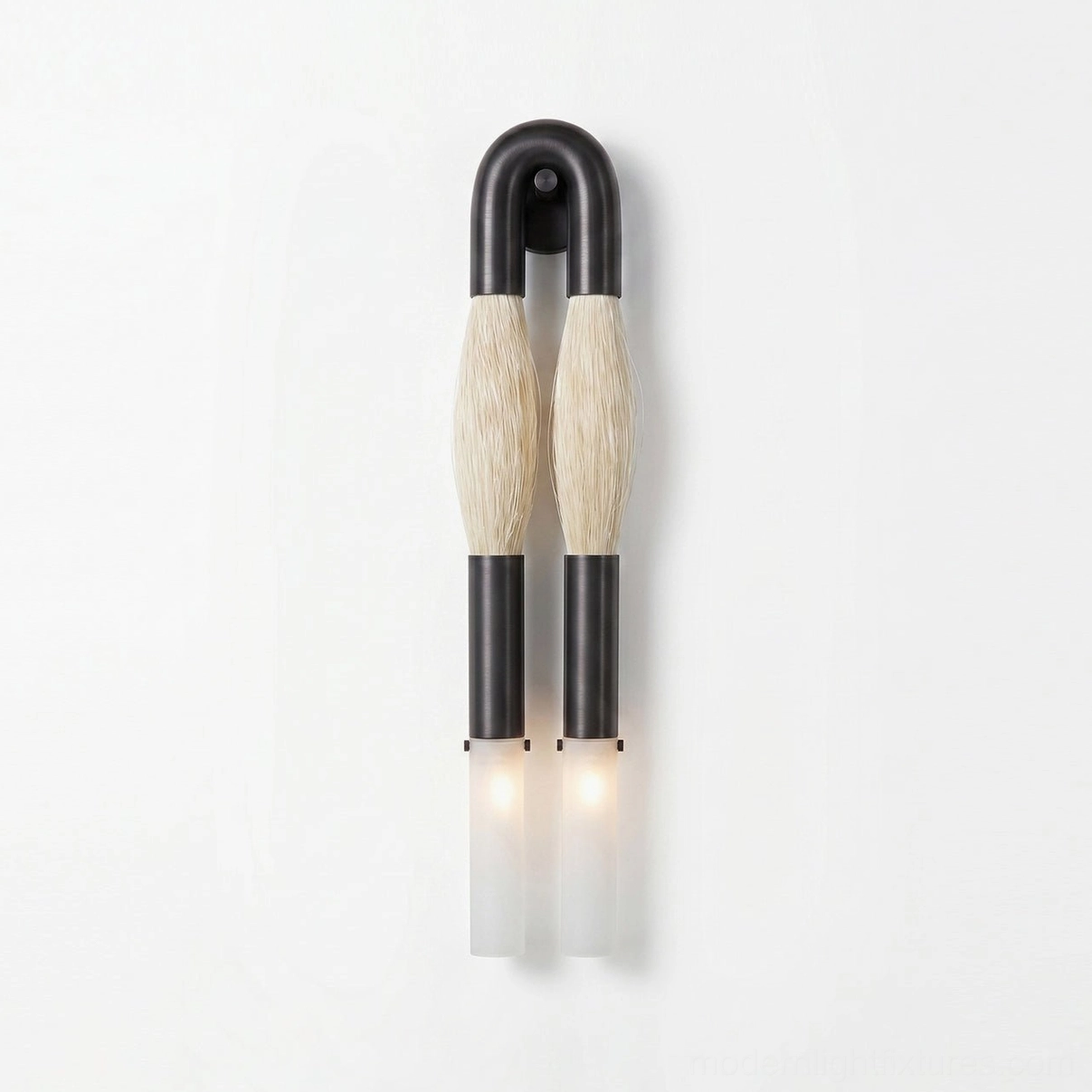 Branwick sculptural wall sconce in aged brass finish with frosted glass diffusers installed as dual-head ambient lighting fixture