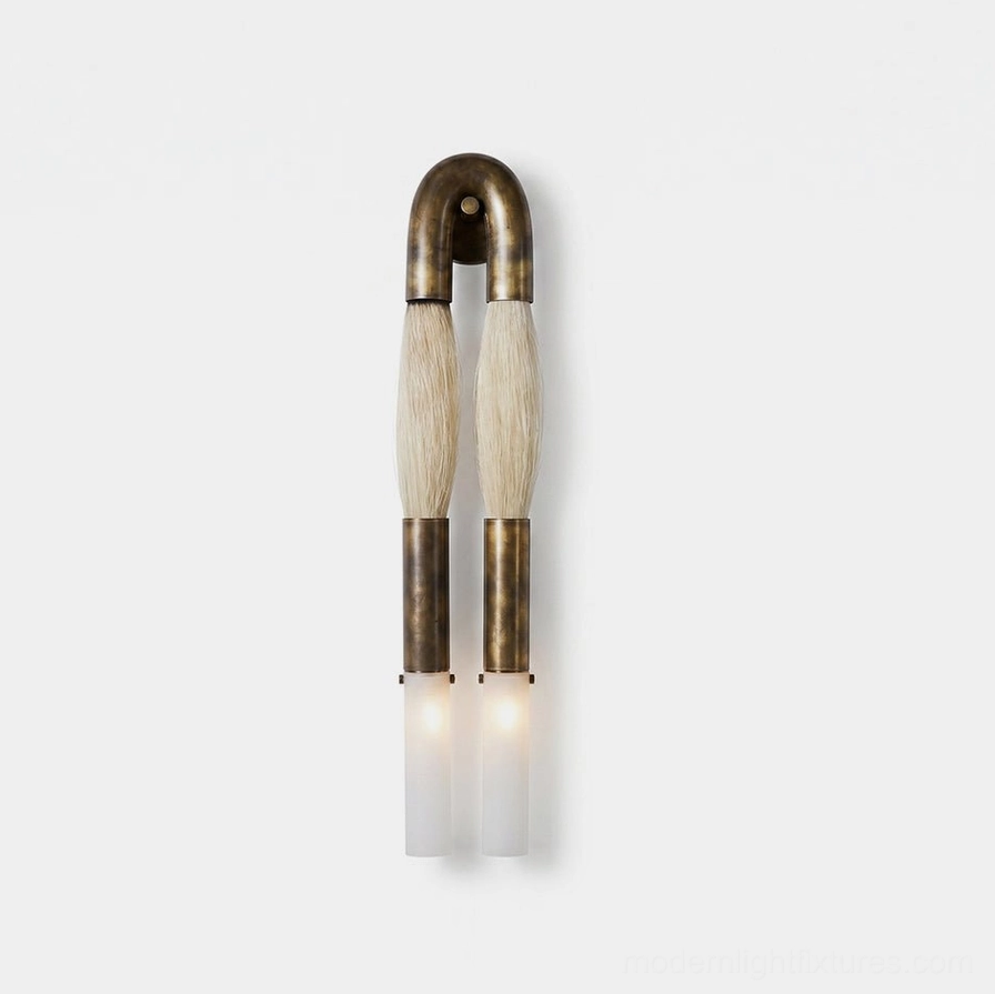 Branwick sculptural wall sconce with aged brass frame, frosted glass diffusers, and wrapped horsehair details on white background