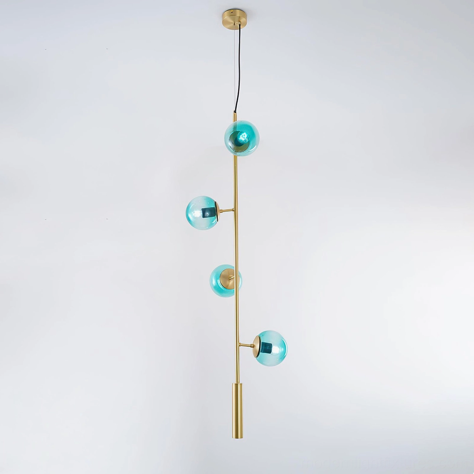 Brass finish orb chandelier with blue glass spheres in luxury residential setting