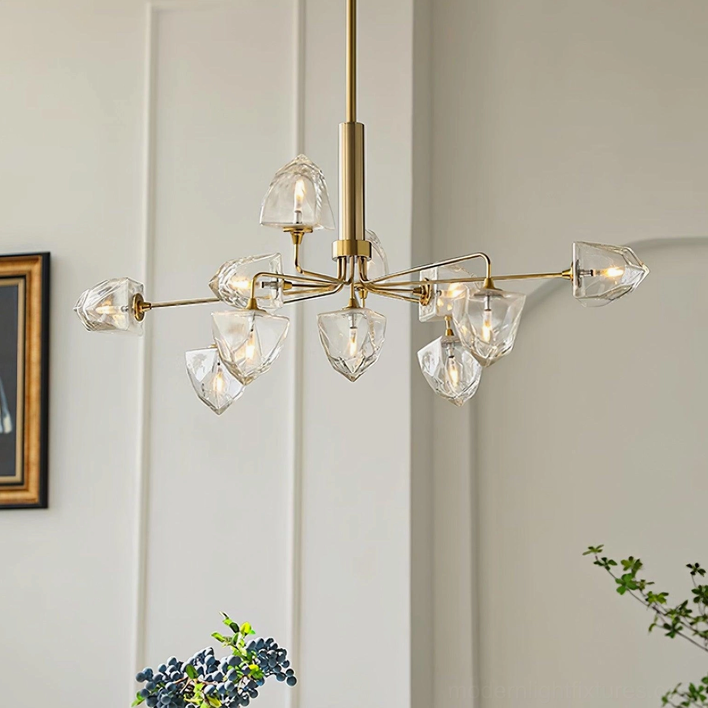 Brass branch modern chandelier with clear faceted glass covers in minimalist contemporary living room
