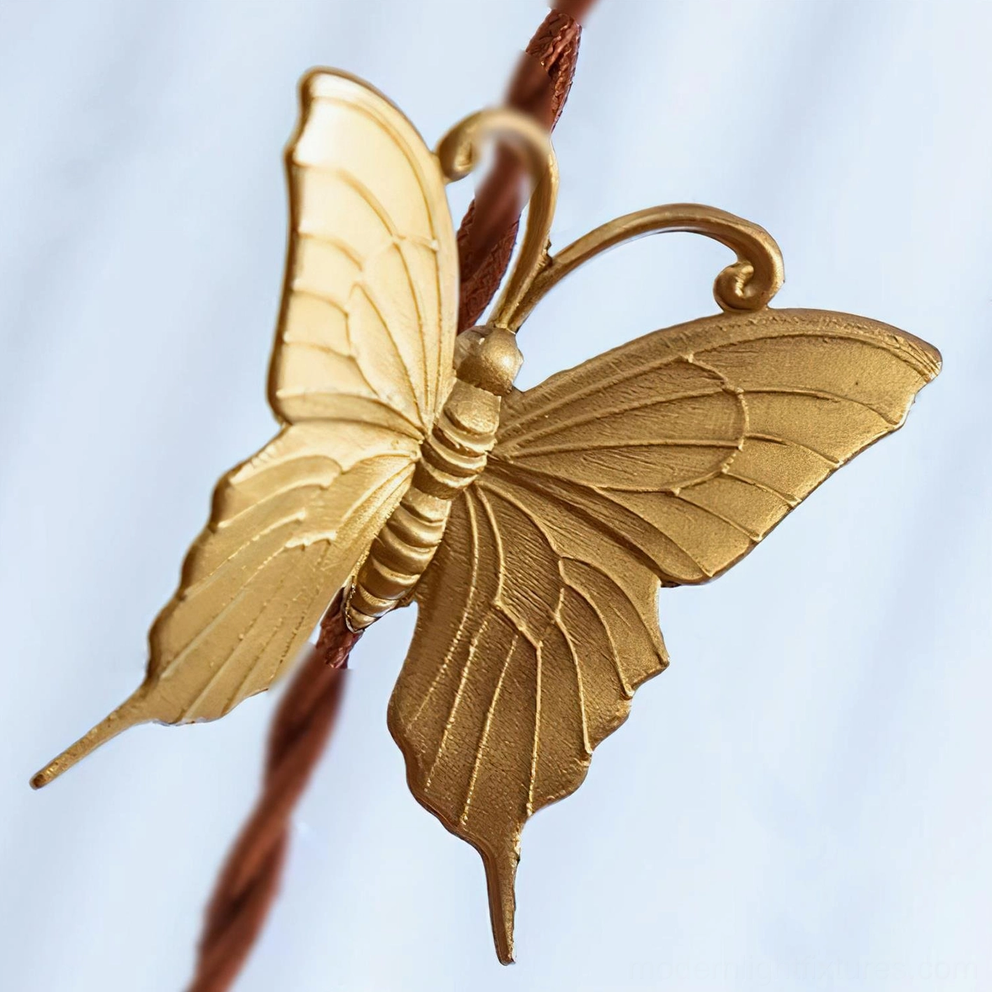 Cast brass butterfly ornament detail on twisted cord, vintage pendant light accent