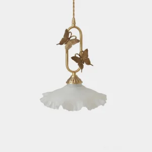 Brass butterfly pendant light with ruffled frosted glass shade, front studio view showing cast brass butterfly detail