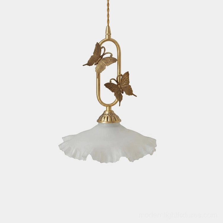 Brass butterfly pendant light with ruffled frosted glass shade, front studio view showing cast brass butterfly detail