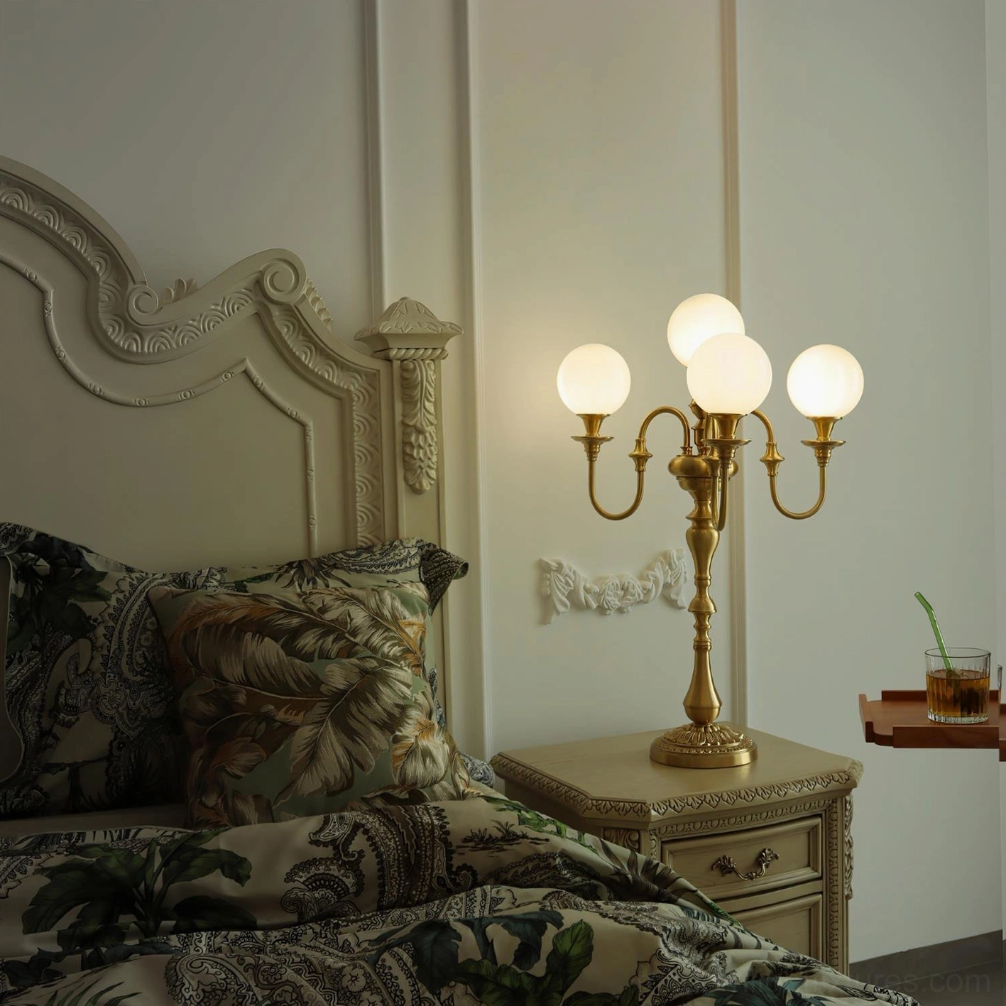Brass table lamp multi-head configuration with glass diffusers creating warm ambient lighting