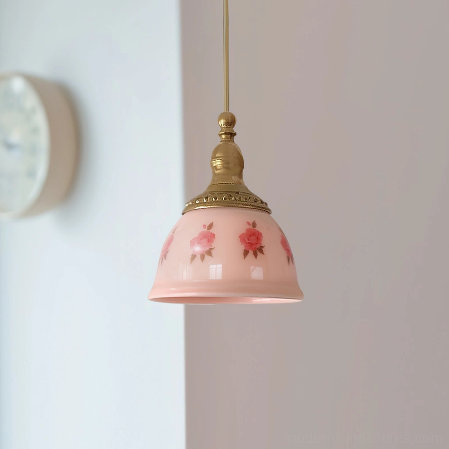 Brass gold fixture ceramic floral pendant lamp showing bell-shaped pink shade with red rose and vine details