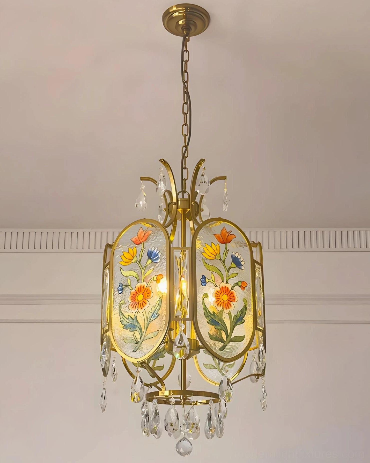 Brass and crystal floral pendant light showing artistic glass painting detail and luminous crystal accent embellishments