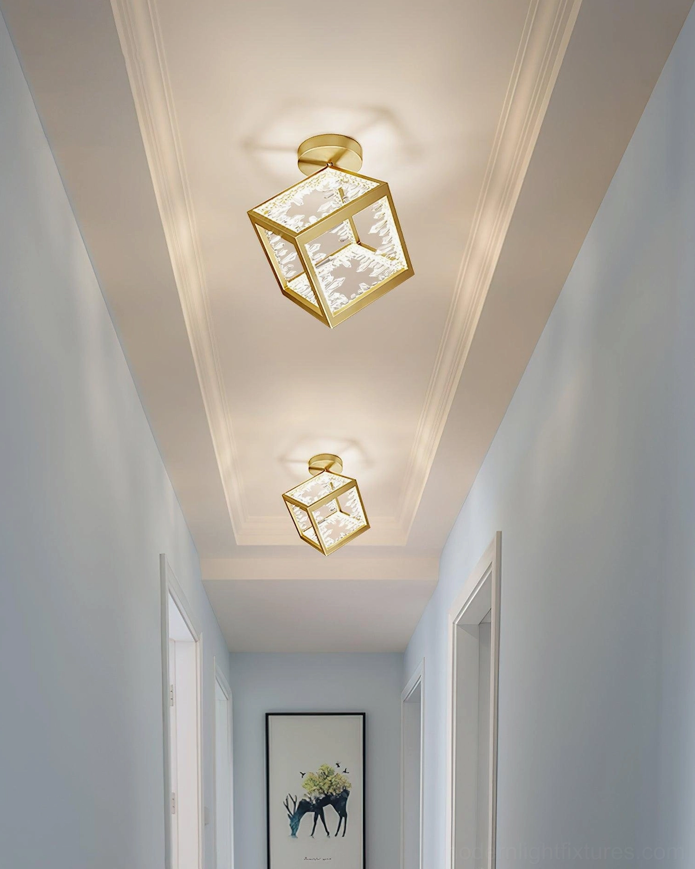 Spaced brass gold glass cube ceiling fixtures in narrow residential corridor