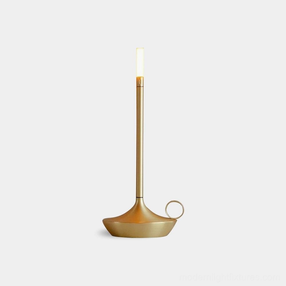 Minimalist LED candle table lamp in brass gold metal finish, front view showing refined cylindrical silhouette and smooth aluminum construction