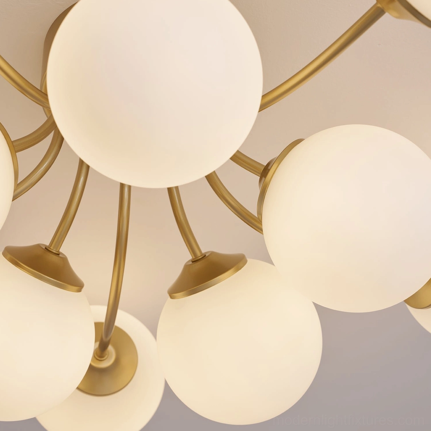 Brass gold sputnik ball ceiling light fixture in modern Nordic interior design setting