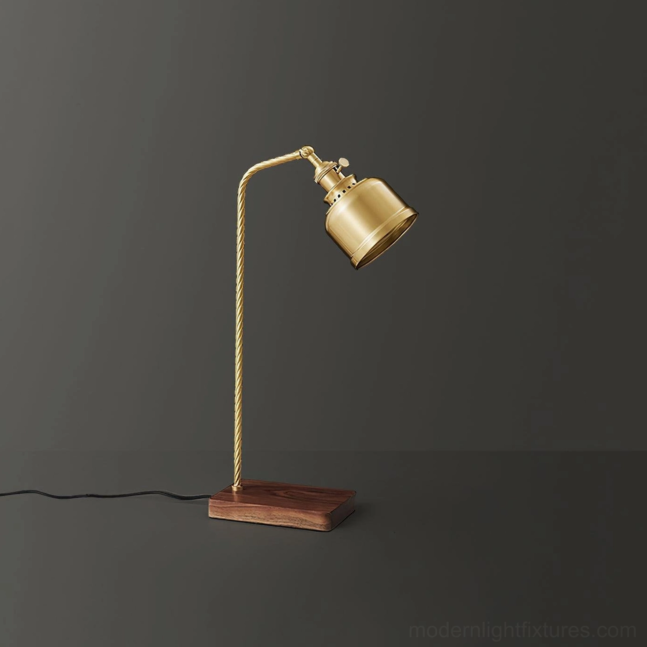 Walnut wood base and brass column of adjustable table lamp showing natural wood texture and finish