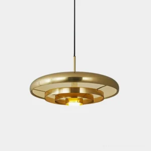 Resonant brass pendant light with polished gold concentric circular layers in front close-up view