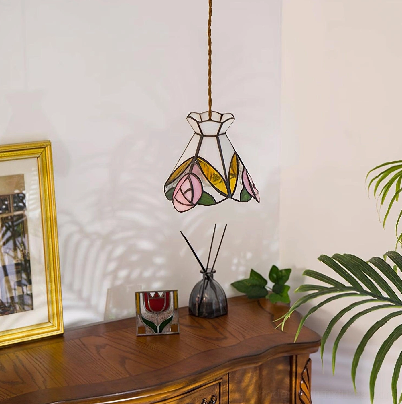 Brass and pink Tiffany rose pendant fixture highlighting quality materials and artistic glass work