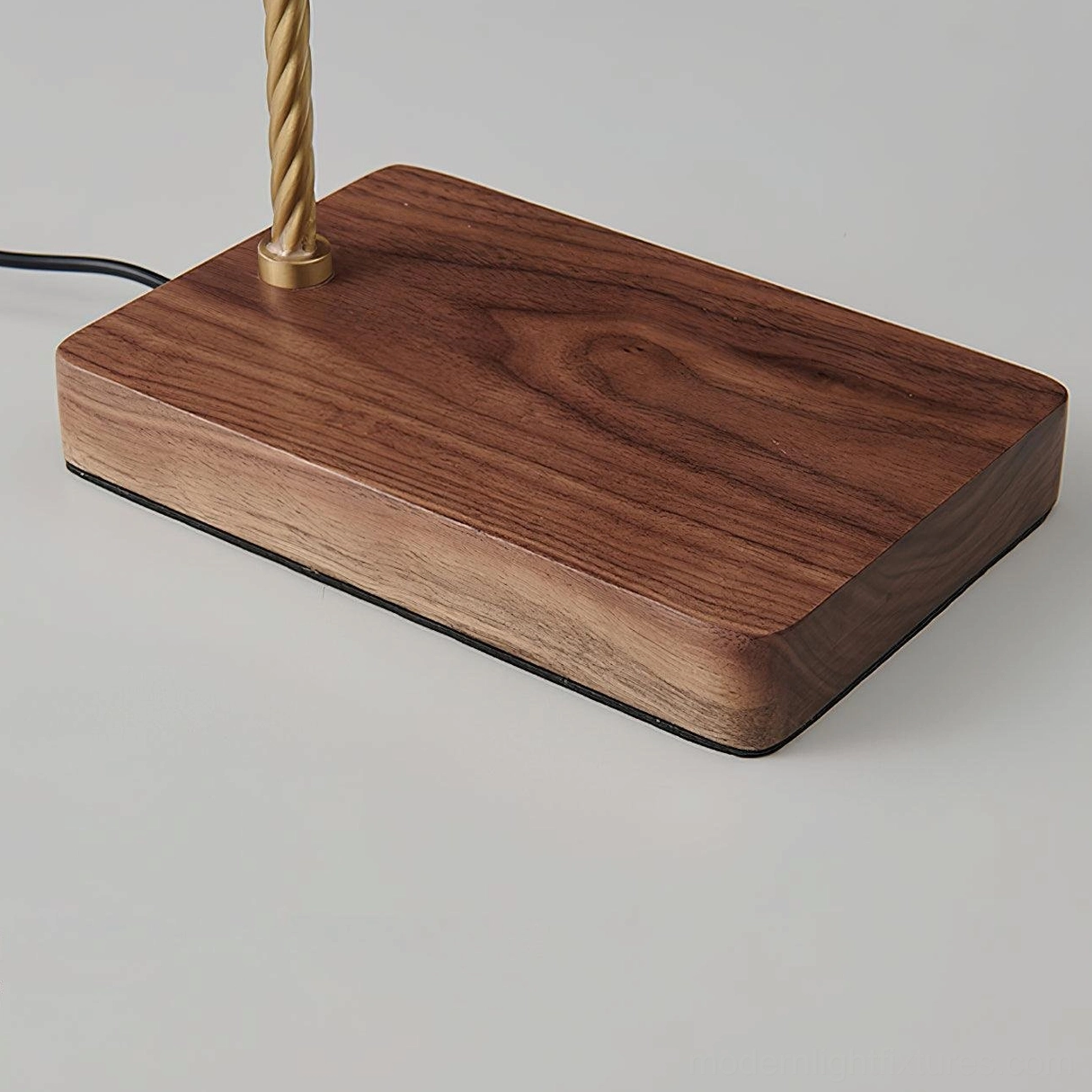 Brass industrial table lamp in contemporary interior setting demonstrating mid-century modern style compatibility